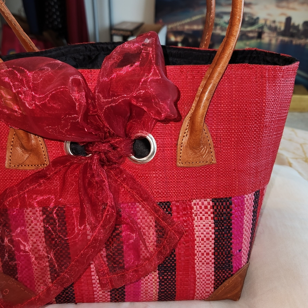 Beautiful African traditional bag with leather handle and corners.